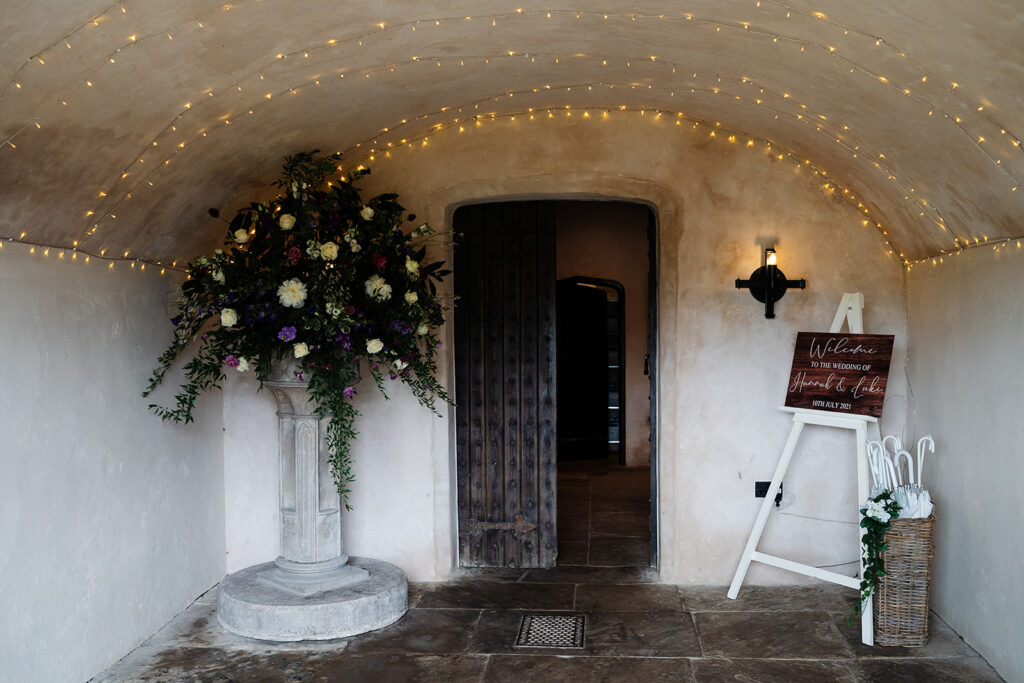 Enchanting entrance with flowers and warm fairy lights at The Priests House in Barden, North Yorkshire