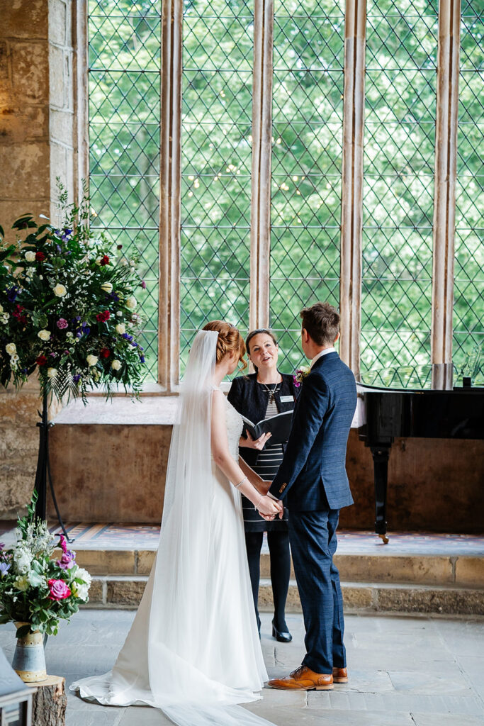 Couple exchanging vows in a historic church ceremony The Priests House in Barden, North Yorkshire