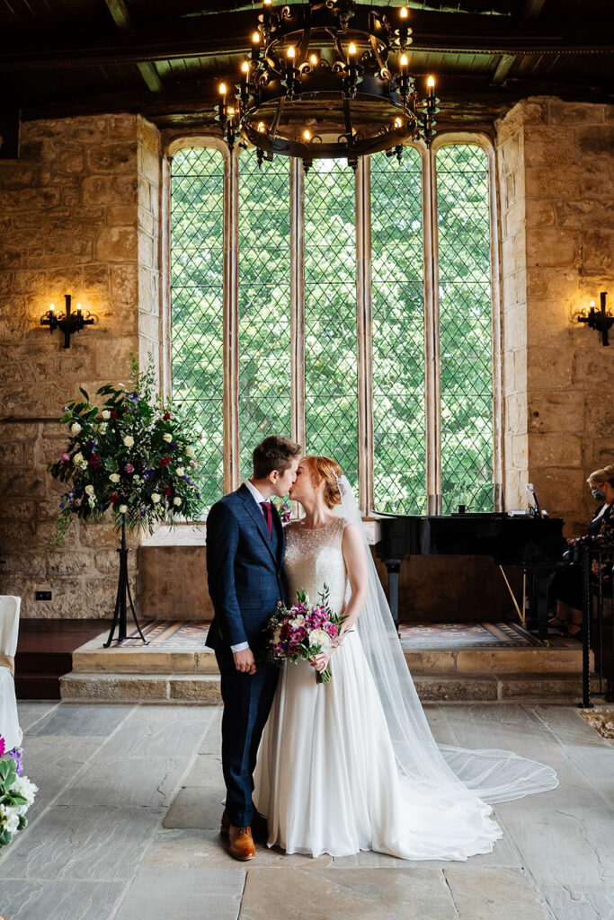 Bride and groom sharing a tender moment in elegant venue The Priests House in Barden, North Yorkshire