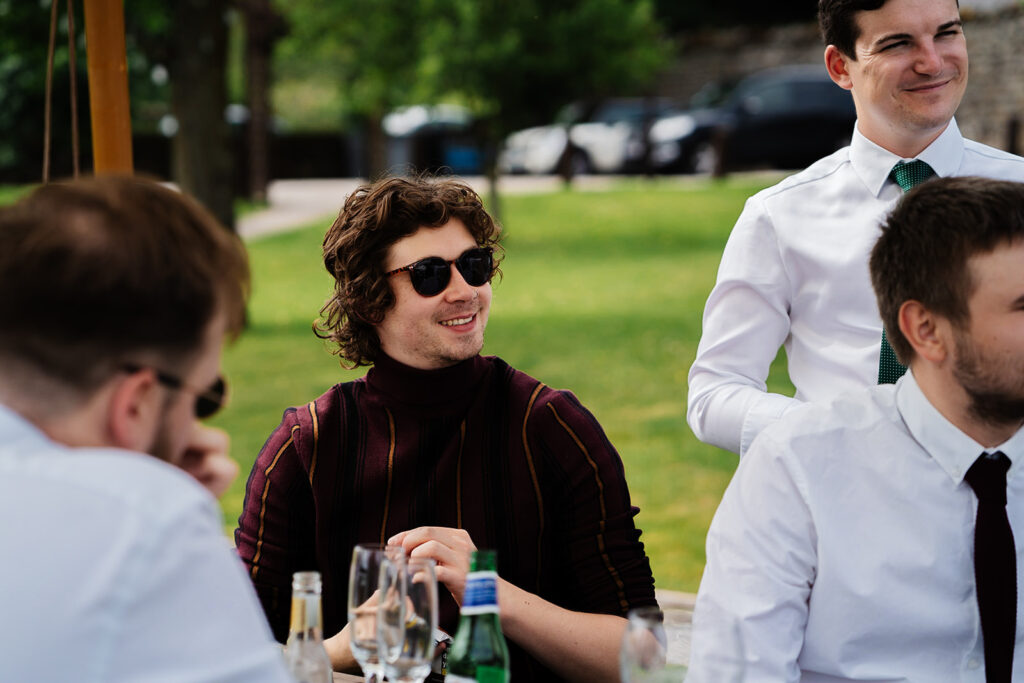 People enjoying an outdoor gathering on a sunny day