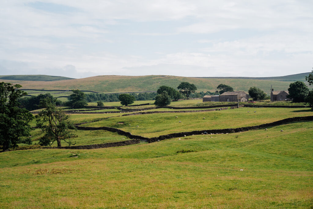 Rolling English countryside landscape with stone walls and fields The Priests House in Barden, North Yorkshire