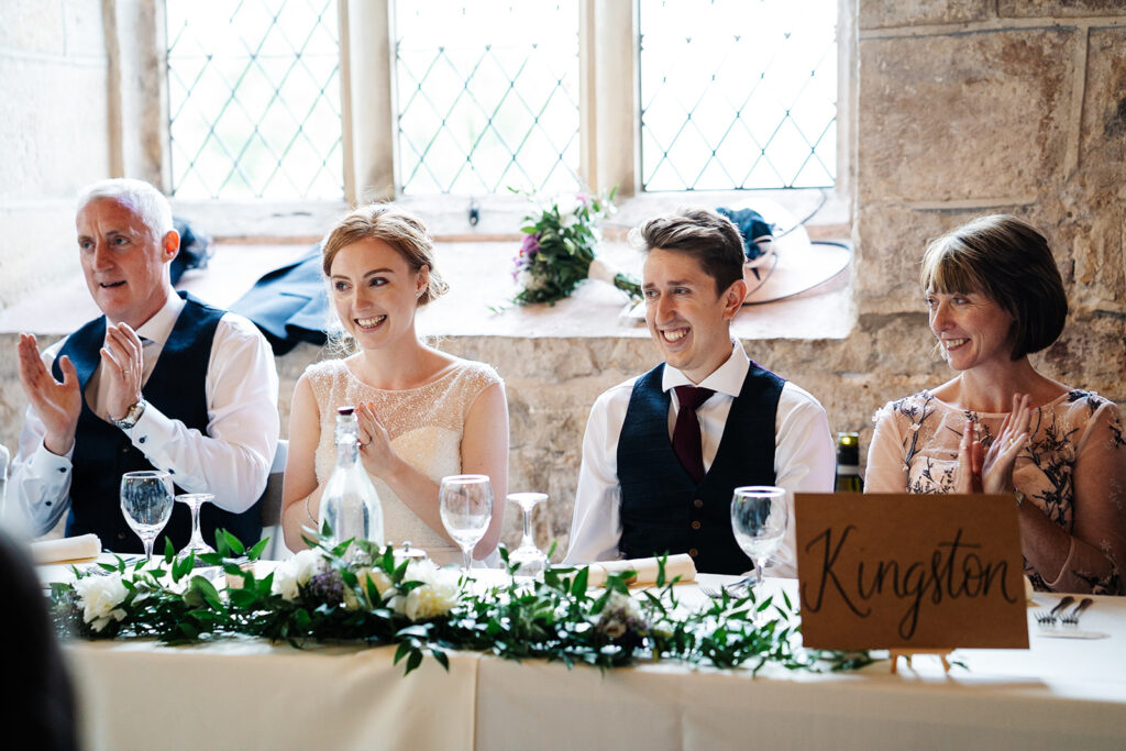 Wedding guests seated at a table during celebration