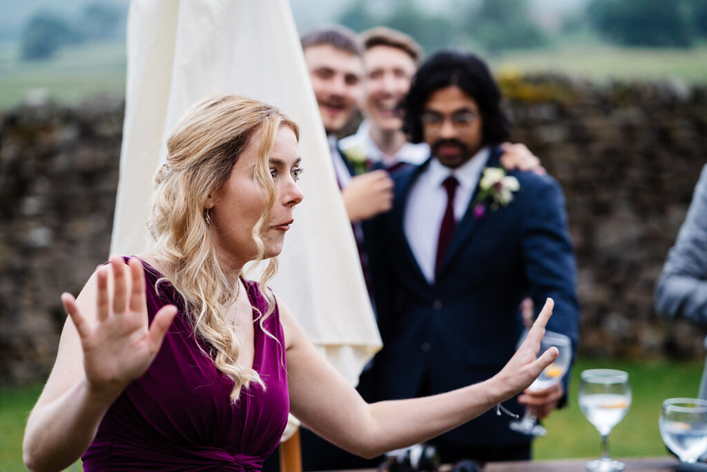 Woman in purple dress enjoying an outdoor event with friends
