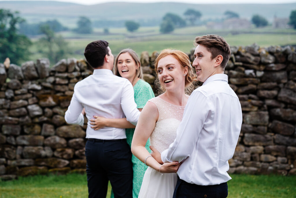 Couples dancing at an outdoor celebration in the countryside