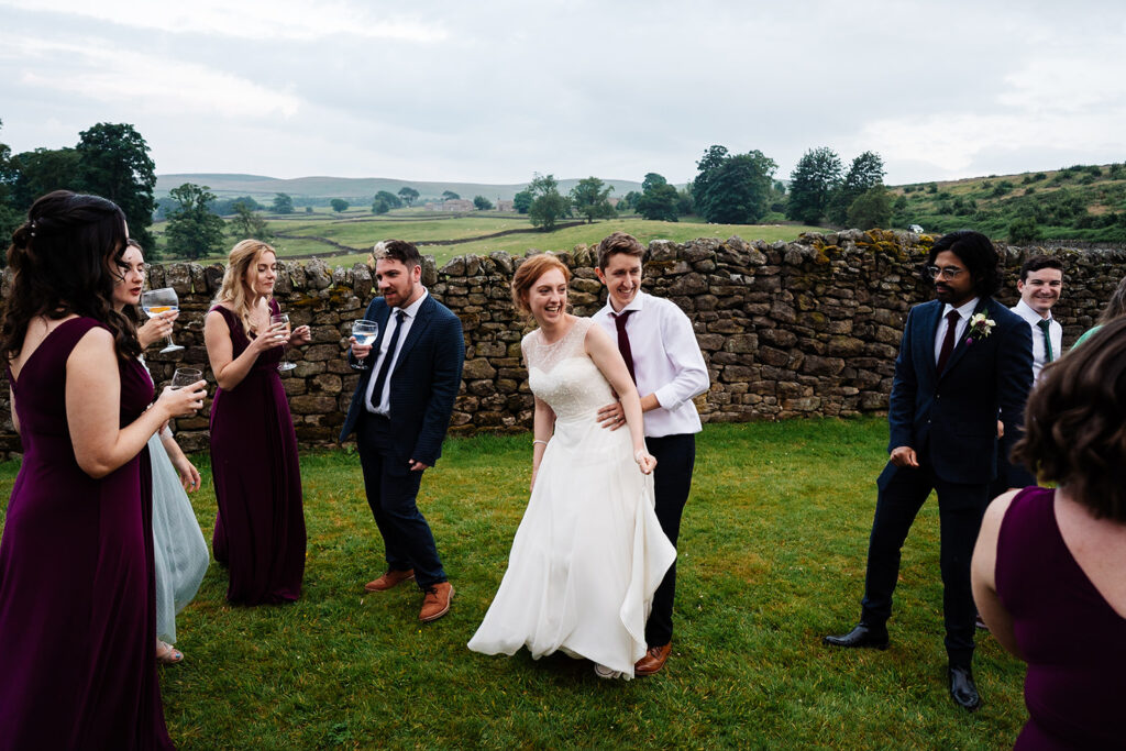 Bride and groom dancing at outdoor wedding celebration