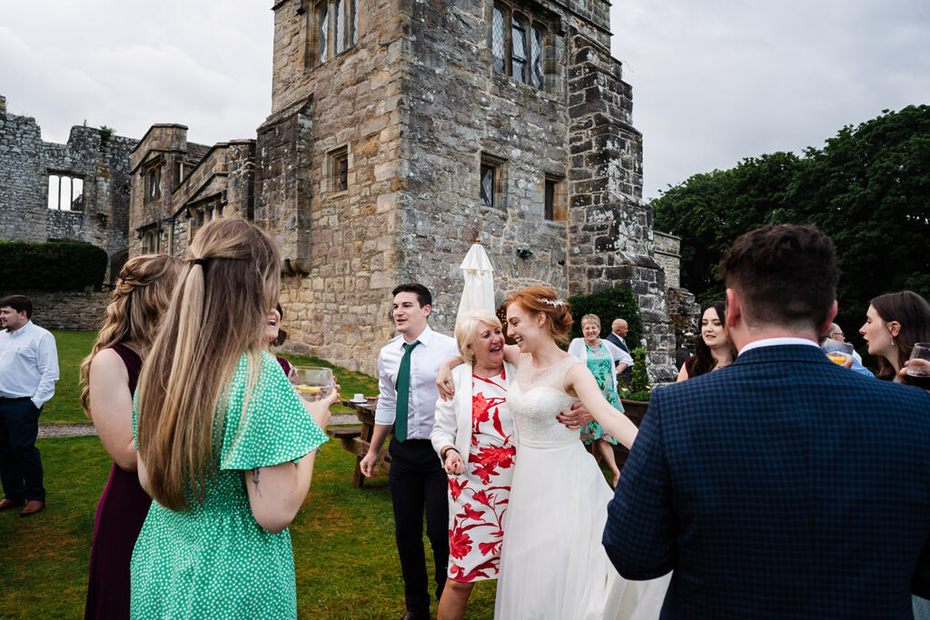 Guests enjoying a celebration at historic castle venue The Priests House in Barden, North Yorkshire