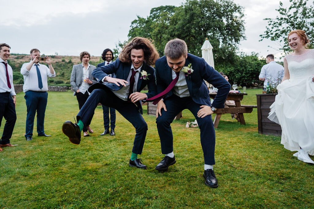 People enjoying outdoor wedding celebrations with laughter The Priests House in Barden, North Yorkshire