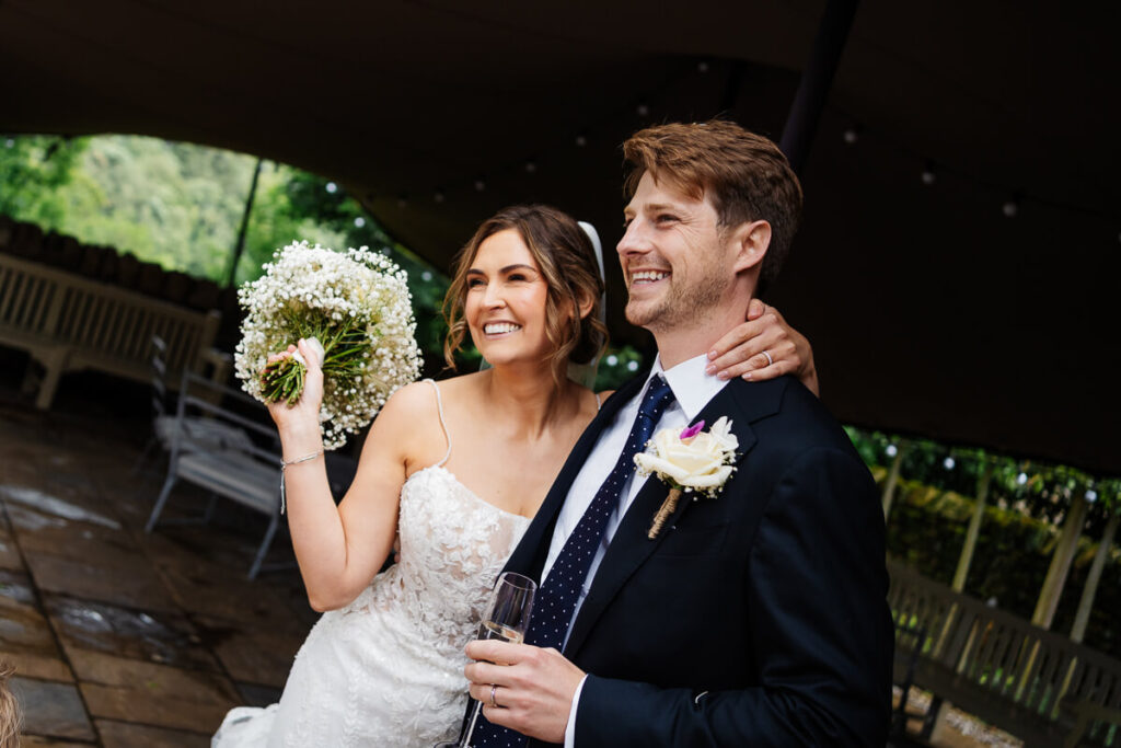 Smiling bride and groom celebrating on their wedding day