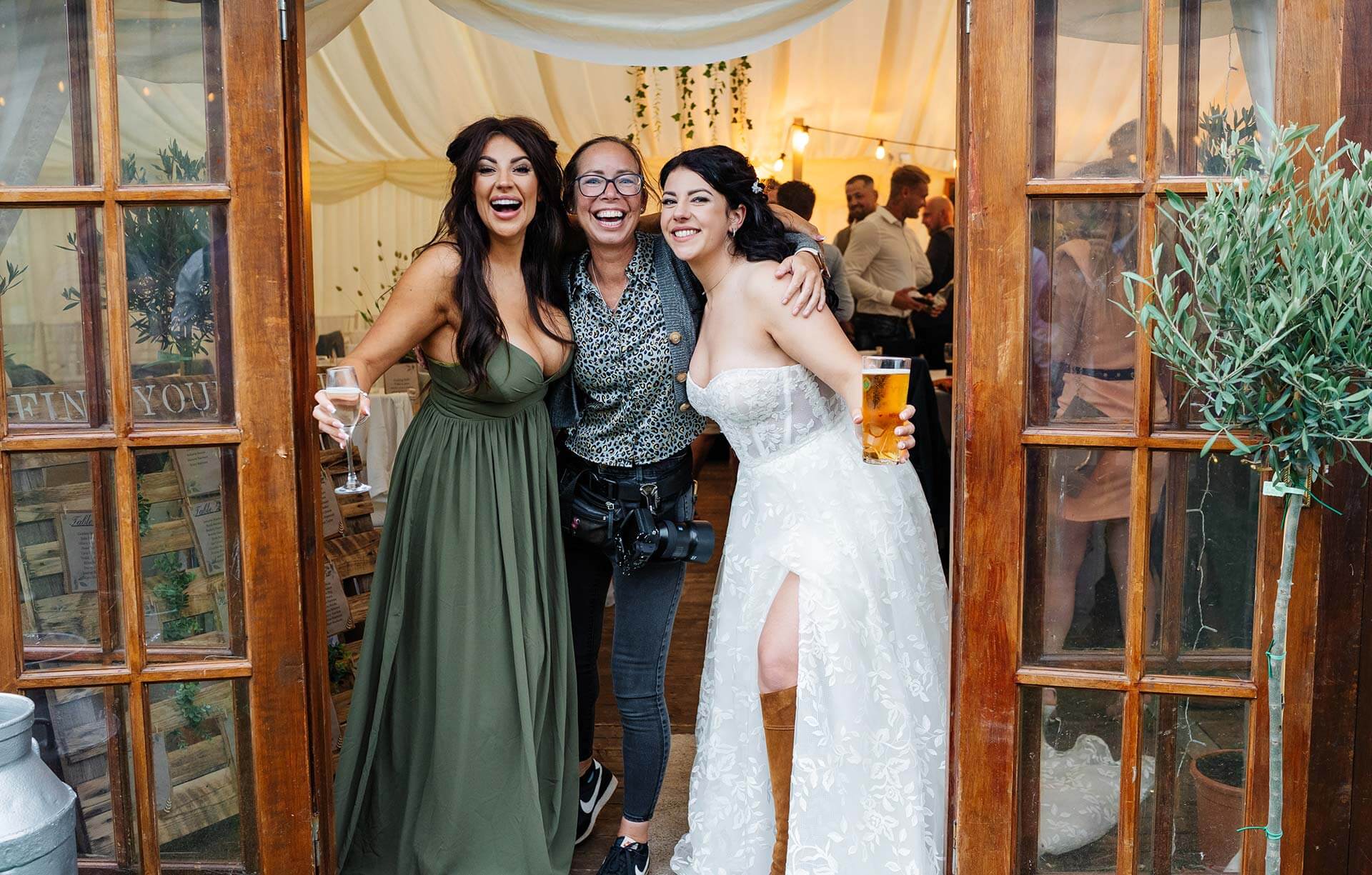 Friends celebrating at a lively wedding reception party