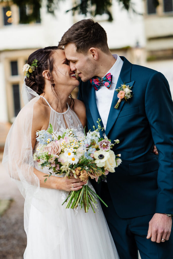 Bride and groom sharing a romantic moment on their wedding day