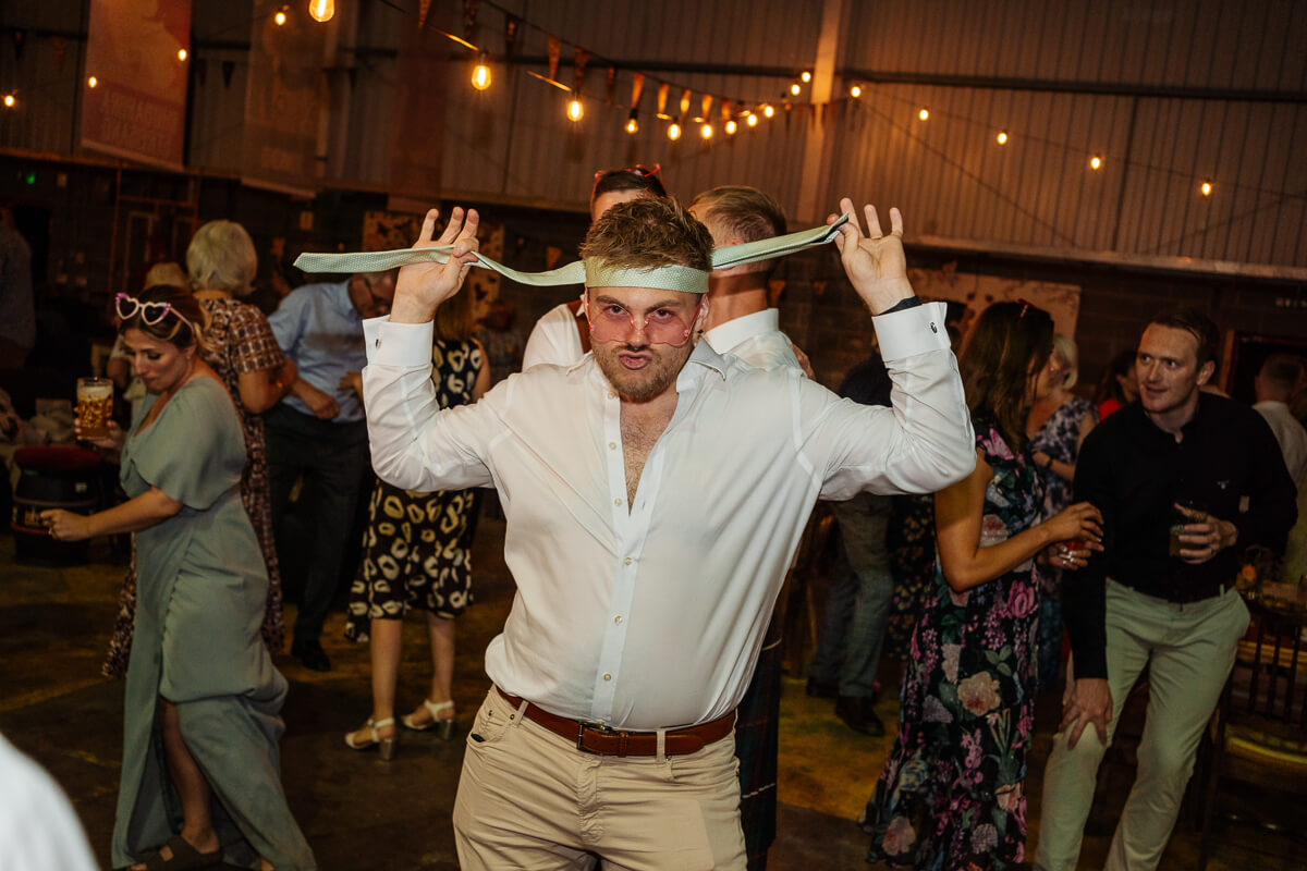 Man dancing energetically at a lively party celebration